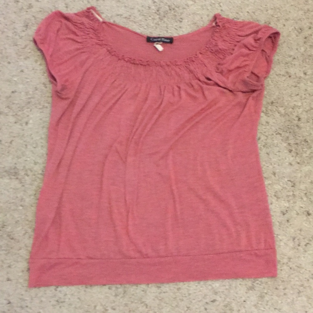 A cute pink shirt with ruffles